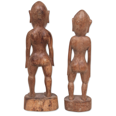 Wood sculptures, 'Ancient Asmat' (pair) - Pair of Suar Wood Man and Woman Sculptures from Bali