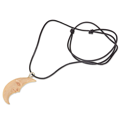 Bone and leather pendant necklace, 'Serene Crescent Moon' - Hand Carved Balinese Moon Necklace in Leather and Bone