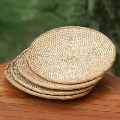 Natural fiber serving plates, 'Lombok Moon' (set of 4) - Set of 4 Handwoven Natural Fiber Serving Plates from Bali