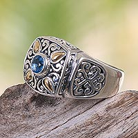 Gold accented blue topaz single stone ring, 'Jungle Petals' - Balinese Sterling Silver Ring with Amethyst and Gold Accents