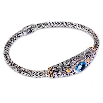 Gold accent blue topaz braided bracelet, 'Bedugul Garden' - Handcrafted Balinese Gold Accent Blue Topaz Silver Bracelet