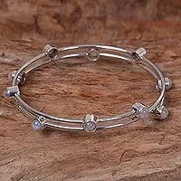 Rainbow moonstone bangle bracelet, 'Orchid Twist in White' - Sterling Silver Rainbow Moonstone Bracelet Indonesia