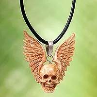 Bone pendant necklace, 'Flying Skull' - Hand Carved Bone Pendant Necklace of a Skull from Indonesia