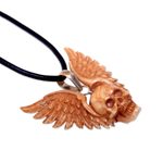 Bone pendant necklace, 'Flying Skull' - Hand Carved Bone Pendant Necklace of a Skull from Indonesia