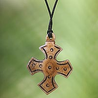 Bone pendant necklace, 'Sacred Bone' - Cross Bone Pendant Necklace with Leather Cord from Bali