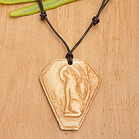 Bone pendant necklace, 'Coyote Song' - Carved Bone Pendant Necklace with Coyote Made in Indonesia