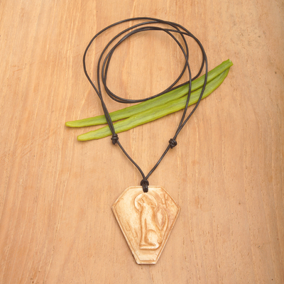 Bone pendant necklace, 'Coyote Song' - Carved Bone Pendant Necklace with Coyote Made in Indonesia