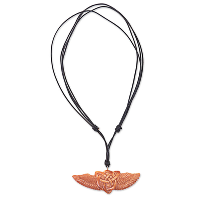 Bone pendant necklace, 'Celtic Wings' - Hand Carved Cow Bone Celtic Pendant Leather Cord Necklace