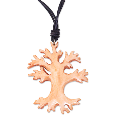 Bone and leather pendant necklace, 'Balinese Banyan Tree' - Leather Necklace with a Hand Carved Bone Tree Pendant