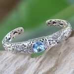 Blue topaz cuff bracelet, 'Sacred Garden in Blue' - Blue Topaz and Sterling Silver Cuff Bracelet from Indonesia