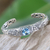 Blue topaz cuff bracelet, 'Sacred Garden in Blue' - Blue Topaz and Sterling Silver Cuff Bracelet from Indonesia thumbail