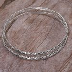 Sterling silver bangle bracelets, 'Indonesian Moon' (pair) - Two 925 Sterling Silver Handmade Engraved Bangles from Bali