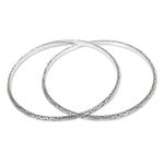 Sterling silver bangle bracelets, 'Indonesian Moon' (pair) - Two 925 Sterling Silver Handmade Engraved Bangles from Bali