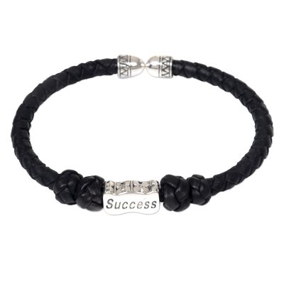 Leather and sterling silver cuff bracelet, 'Success Charm' - Indonesian Leather Braided Bracelet with Success Pendant