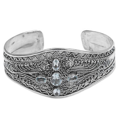 Blue topaz cuff bracelet, 'Directions' - Hand Crafted Sterling Silver and Blue Topaz Cuff Bracelet