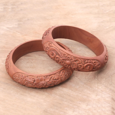 Wood bangle bracelets, 'Bali Blossom' (pair) - Pair of Balinese Hand-Carved Sawo Wood Bangle Bracelets