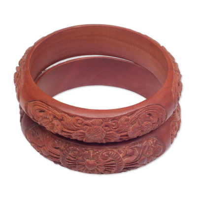 Wood bangle bracelets, 'Floral Intrigue' (pair) - Hand Carved Floral Wood Bangle Bracelets from Bali (Pair)
