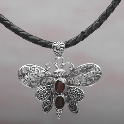 Garnet pendant necklace, 'Bali Moth in Red' - Garnet and Leather Moth Pendant Necklace from Indonesia