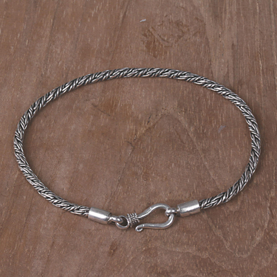 Sterling silver braided bracelet, 'Woven Secret' - Hand Crafted Sterling Silver Braided Bracelet from Indonesia