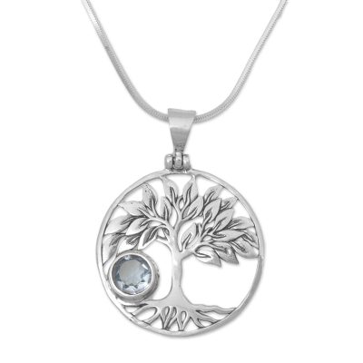 Blue topaz pendant necklace, 'Sandalwood Shade' - Topaz and Sterling Silver Tree Pendant Necklace from Bali