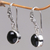 Onyx dangle earrings, 'Purity of Moonlight' - Black Onyx Sterling Silver Earrings Handcrafted in Bali