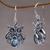 Blue topaz dangle earrings, 'Owl's Tears' - Blue Topaz and Sterling Silver Owl Earrings from Indonesia