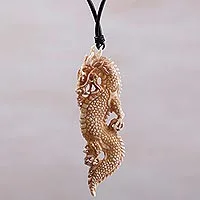 Bone pendant necklace, 'Thorny Dragon' - Bone and Leather Dragon Pendant Necklace from Indonesia