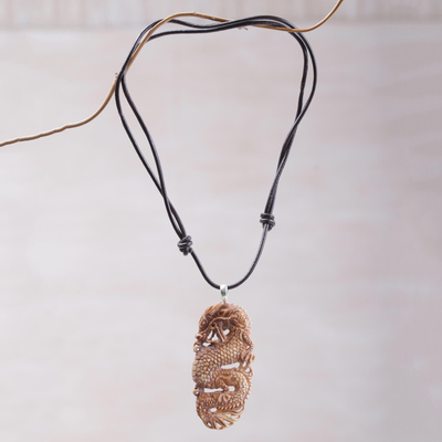 Bone pendant necklace, 'Snarling Dragon' - Bone and Leather Dragon Pendant Necklace from Indonesia