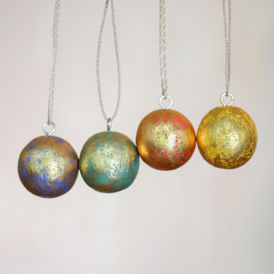 Wood ornaments, 'Golden Baubles' (set of 4) - Four Round Gold Tone Albesia Wood Ornaments from Bali