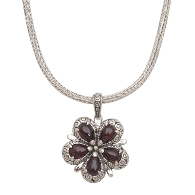 Garnet pendant necklace, 'Bougainvillea Flower' - Garnet and Sterling Silver Floral Pendant Necklace from Bali