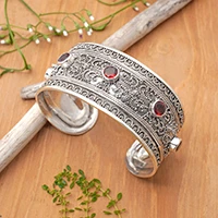 Garnet cuff bracelet, 'Uluwatu Altar' - Balinese Sterling Silver Cuff Bracelet with Garnet 3.5 Cts