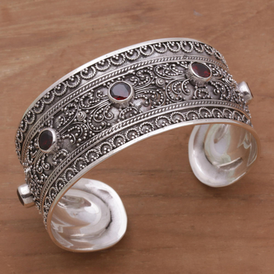 Garnet cuff bracelet, 'Uluwatu Altar' - Balinese Sterling Silver Cuff Bracelet with Garnet 3.5 Cts