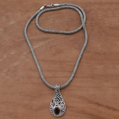 Garnet pendant necklace, 'Patterns of the World' - Garnet and Sterling Silver Drop Pendant Necklace from Bali
