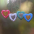 Adornos de madera, (juego de 4) - Cuatro adornos de madera de albesia bali multicolores en forma de corazón