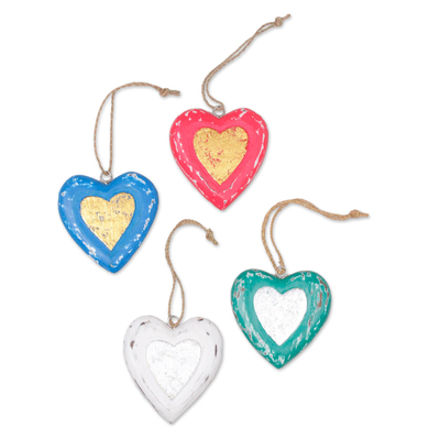 Wood ornaments, 'Festive Love' (set of 4) - Four Heart Shaped Multicolored Bali Albesia Wood Ornaments