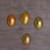 Holzornamente, (4er-Set) - Vier goldfarbene eiförmige Ornamente aus Albesia-Holz aus Bali