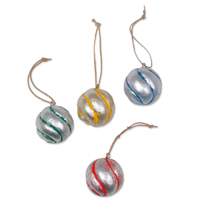 Wood ornaments, 'Festive Spirals' (set of 4) - Four Round Silver Tone Albesia Wood Ornaments from Bali