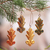 Wood ornaments, 'Festive Fleur-de-Lis' (set of 4) - Four Gold Tone Albesia Wood Ornaments by Balinese Artisans (image 2) thumbail