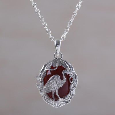 Carnelian pendant necklace, 'Heron Haven' - Carnelian and Sterling Silver Heron Necklace from Bali