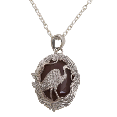 Carnelian pendant necklace, 'Heron Haven' - Carnelian and Sterling Silver Heron Necklace from Bali