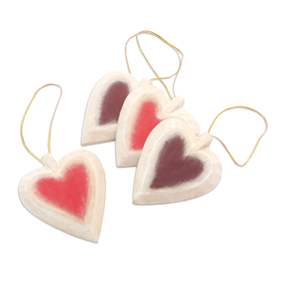 Wood ornaments, 'Ruby Hearts' (set of 4) - Set of Four Painted Wood Heart Ornaments from Bali