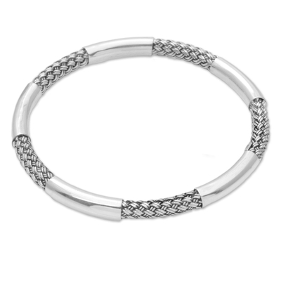 Sterling silver bangle bracelet, 'Celuk Show' - Sterling Silver Woven Motif Bangle Bracelet by Bali Artisans