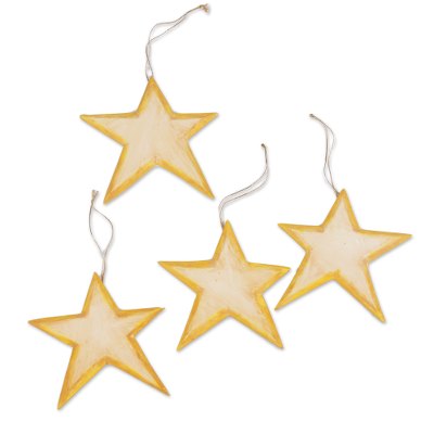 Wood ornaments, 'Yellow Stars' (set of 4) - Set of Four Wood Star Ornaments in Yellow from Bali