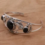 Onyx cuff bracelet, 'Night Leaves' - Onyx and Sterling Silver Leafy Cuff Bracelet from Bali