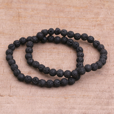 Lava stone beaded stretch bracelets, 'Moon Circles' (pair) - Pair of Beaded Lava Stone Stretch Bracelets from Bali