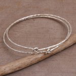 Sterling silver bangle bracelets, 'Why Knot' (pair) - Pair of 925 Sterling Silver Bangle Bracelets from Bali