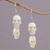 Bone dangle earrings, 'Trunyan Skulls' - Handcrafted Bone Skull Dangle Earrings from Bali thumbail