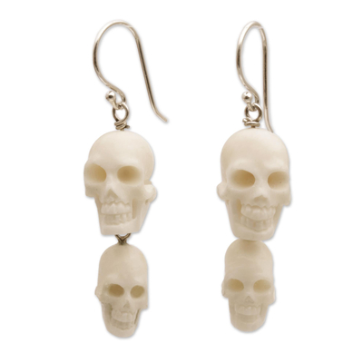 Bone dangle earrings, 'Trunyan Skulls' - Handcrafted Bone Skull Dangle Earrings from Bali