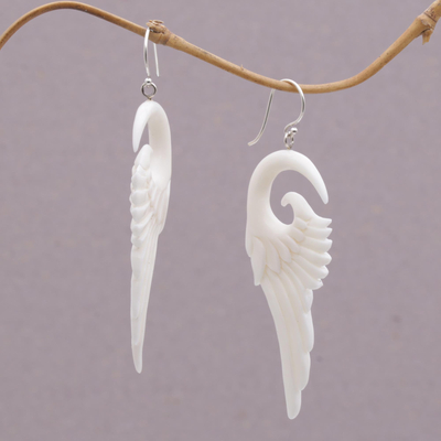 Bone dangle earrings, 'Swirling Wings' - Handcrafted Bone Wing-Shaped Dangle Earrings from Bali