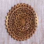 Wood relief panel, 'Sun Bloom' - Hand-Carved Circular Floral Suar Wood Relief Panel from Bali